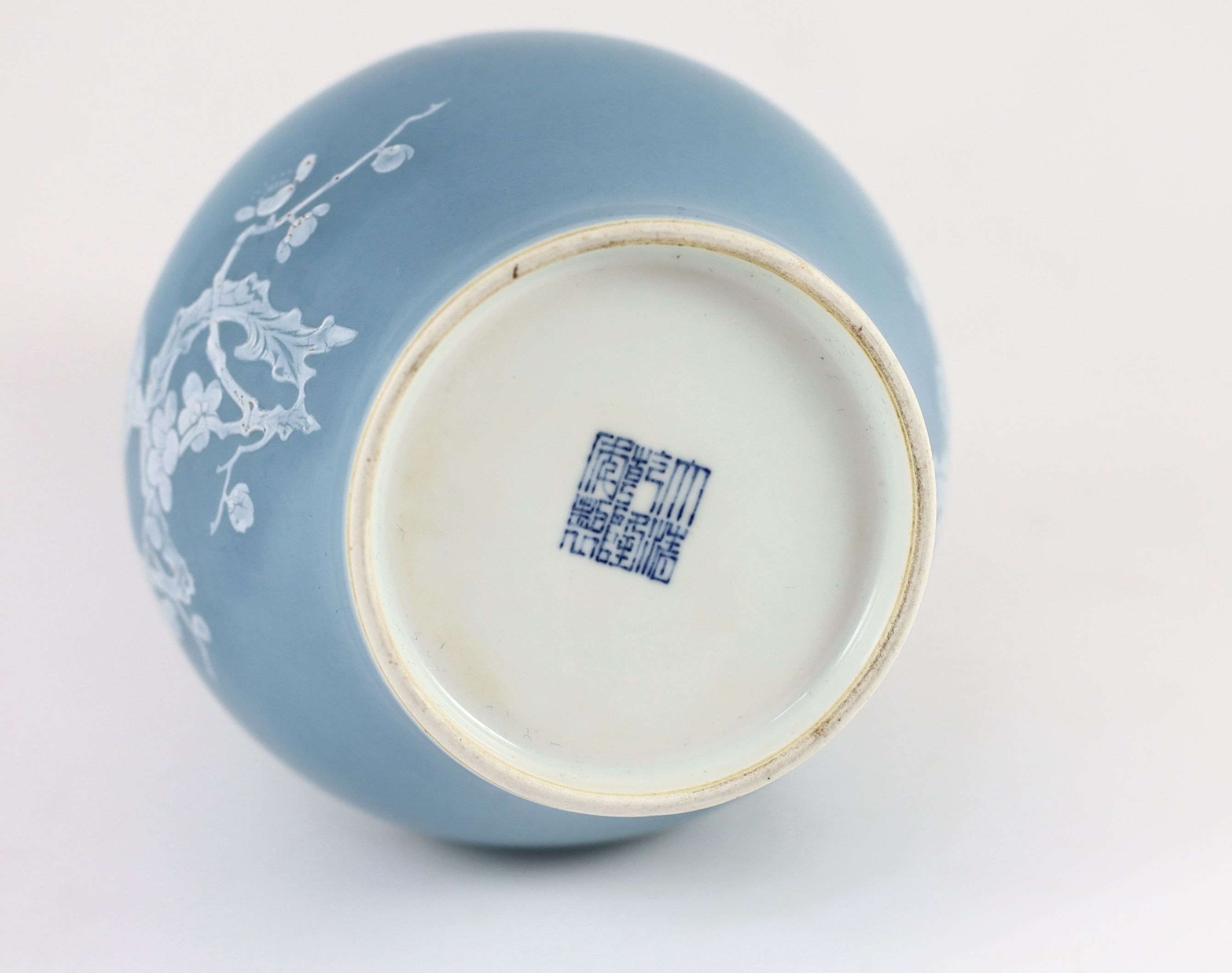 A Chinese claire de lune glazed white slip decorated vase - 25cm high